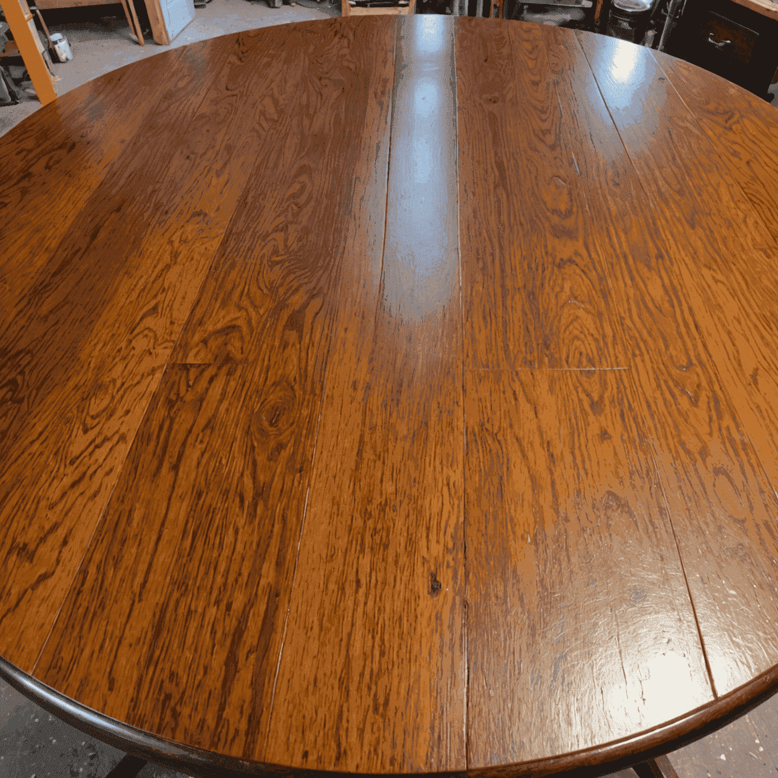 A before and after image of a wooden table being refinished, showing the transformation from a scratched and dull surface to a beautifully polished and rich wood grain