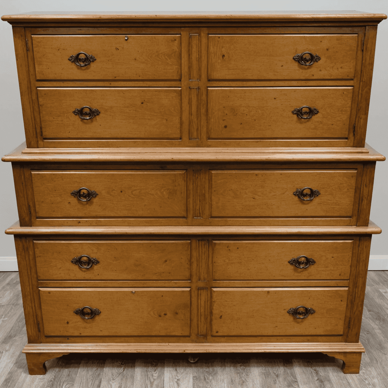 Before and after images of a wooden dresser. The left side shows a worn, outdated piece, while the right side reveals the same dresser beautifully refinished with new hardware and a modern color scheme.